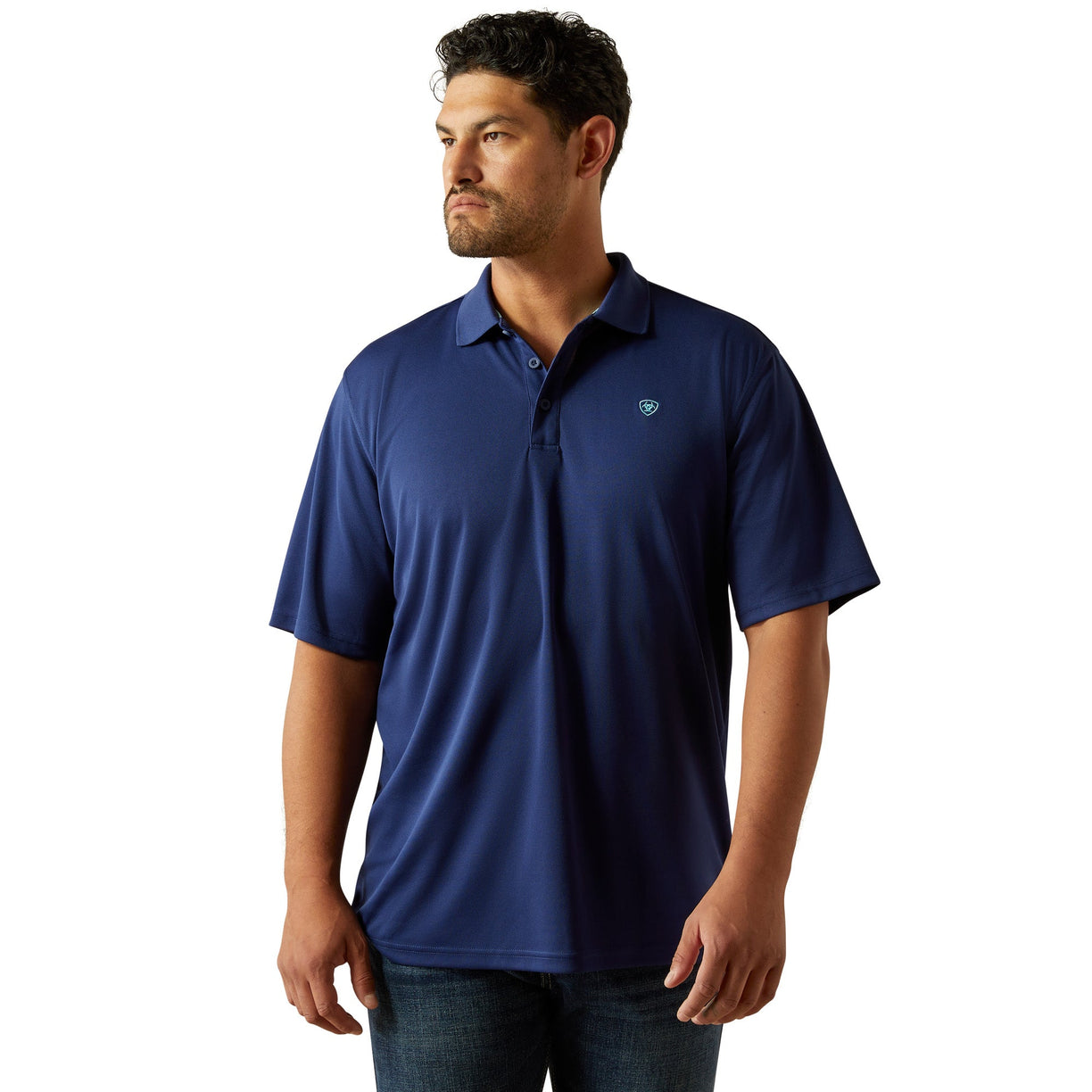 Man wearing a blue polo shirt with a logo on a white background
