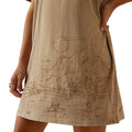 Beige dress with desert landscape design worn by a person