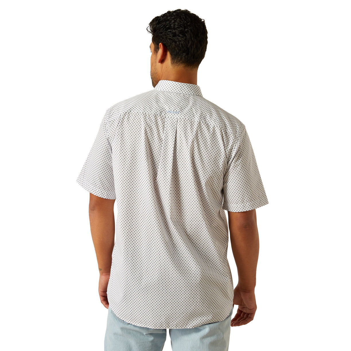 Man wearing a white patterned shirt on a white background
