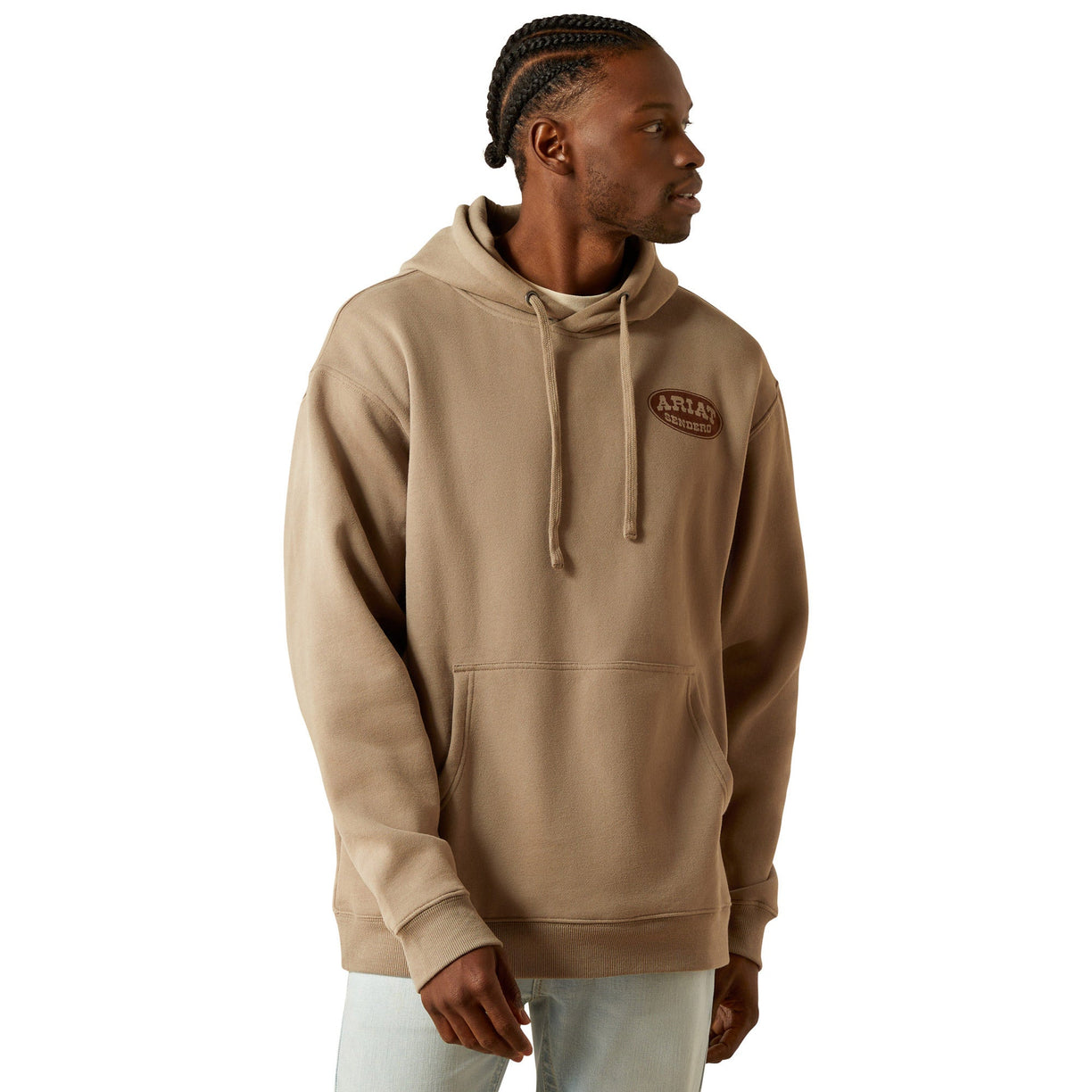 Man wearing a beige hoodie with a logo on a white background