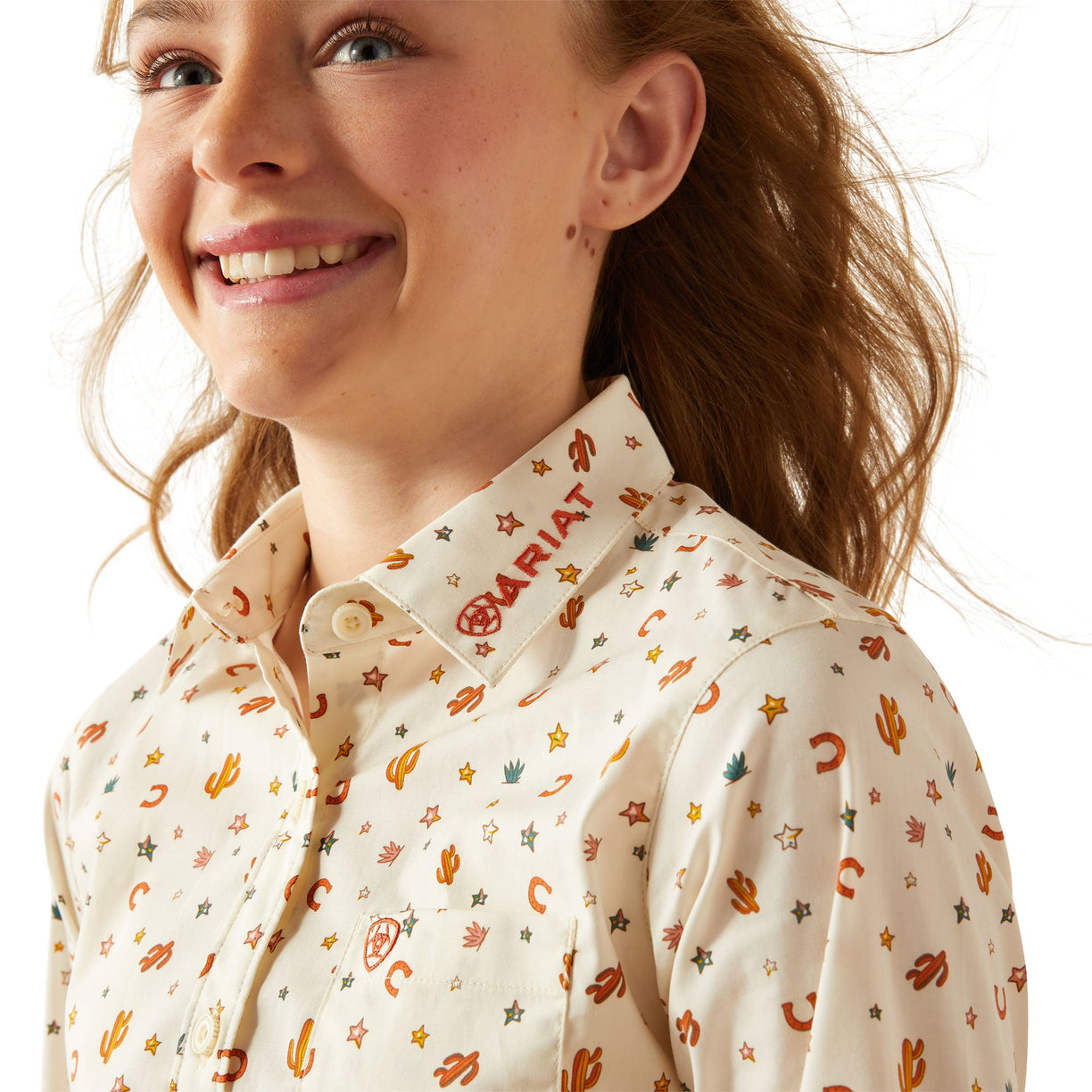 Person wearing a patterned shirt with visible branding on a white background