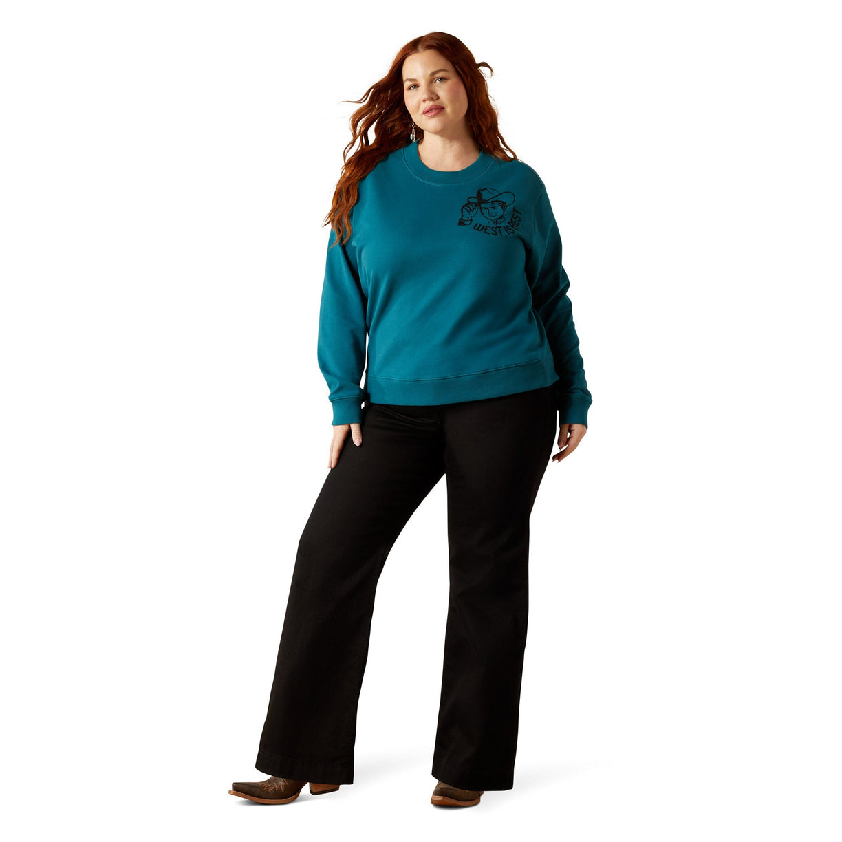 Woman wearing a teal sweater and black pants on a white background