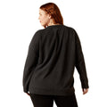Woman wearing a black sweatshirt on a white background