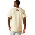 Person wearing a beige t-shirt with a logo on the back against a white background