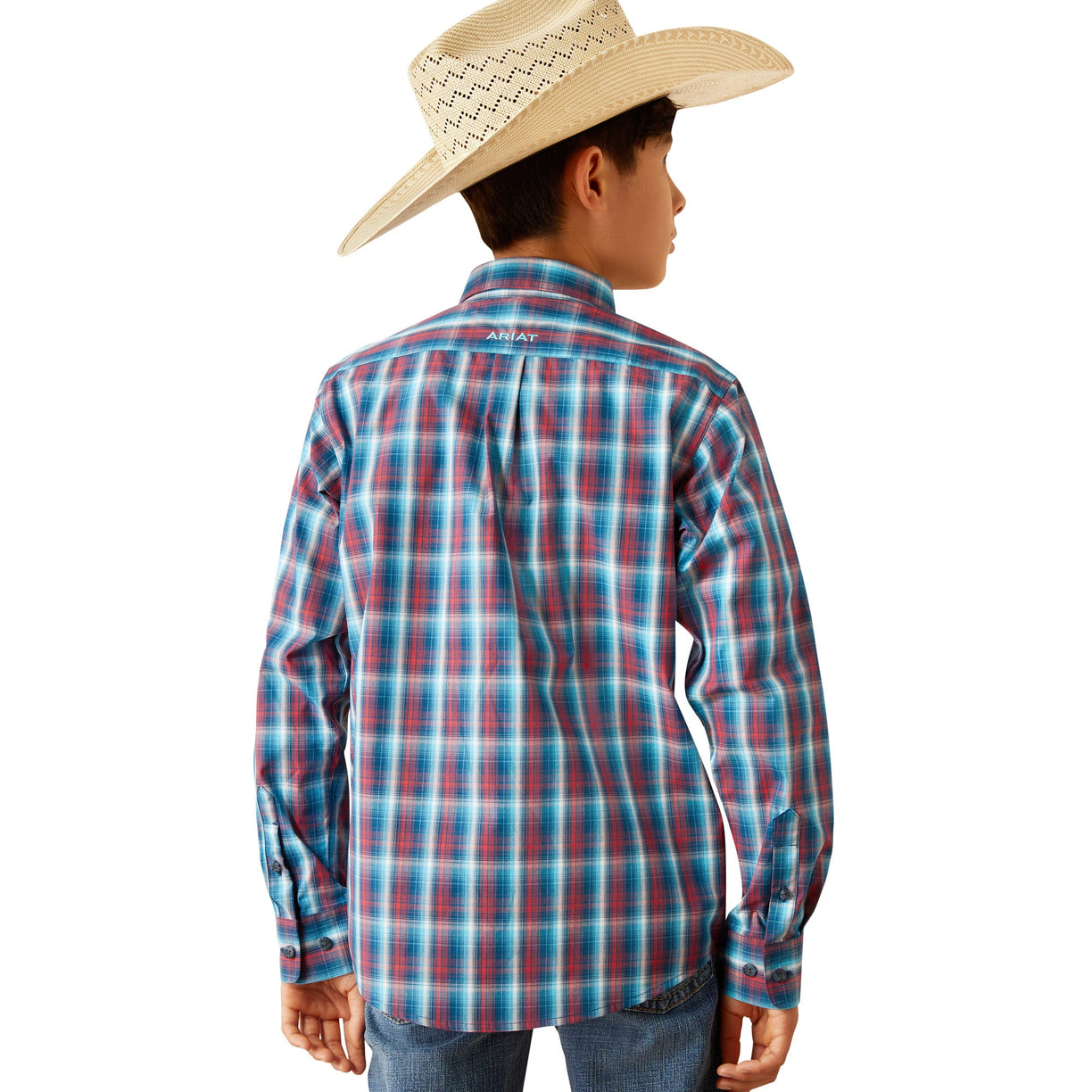 Child wearing a blue and red plaid shirt with a cowboy hat on a white background