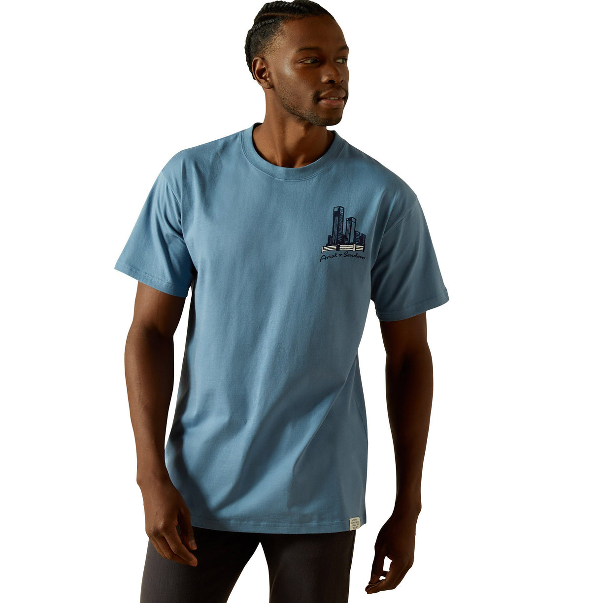 Man wearing a blue t-shirt with a graphic design on a white background