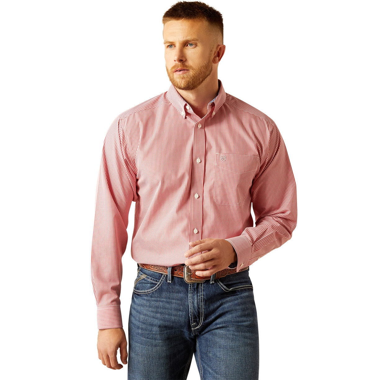 Man wearing a pink checkered shirt and blue jeans on a white background