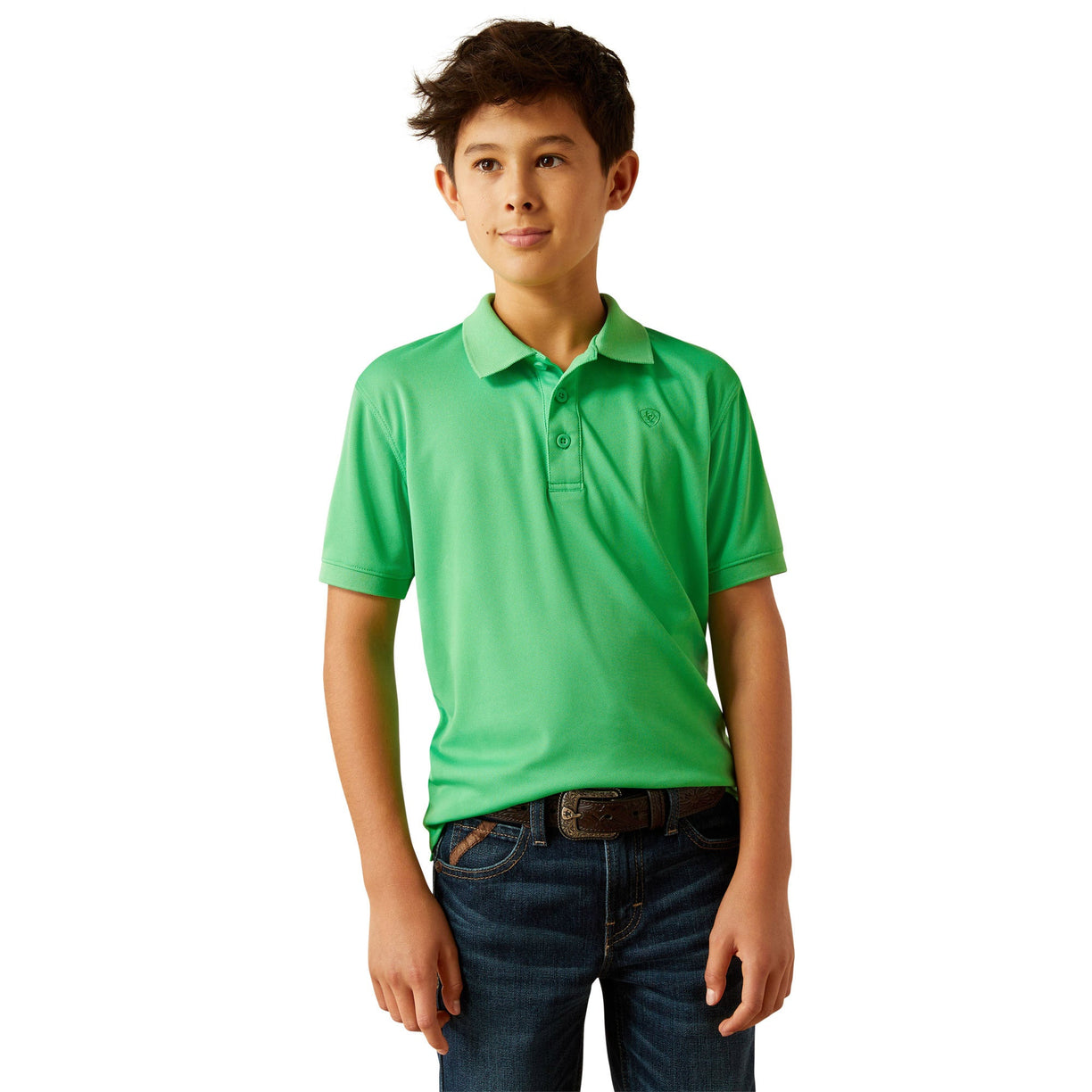 Young boy wearing a green polo shirt and blue jeans on a white background