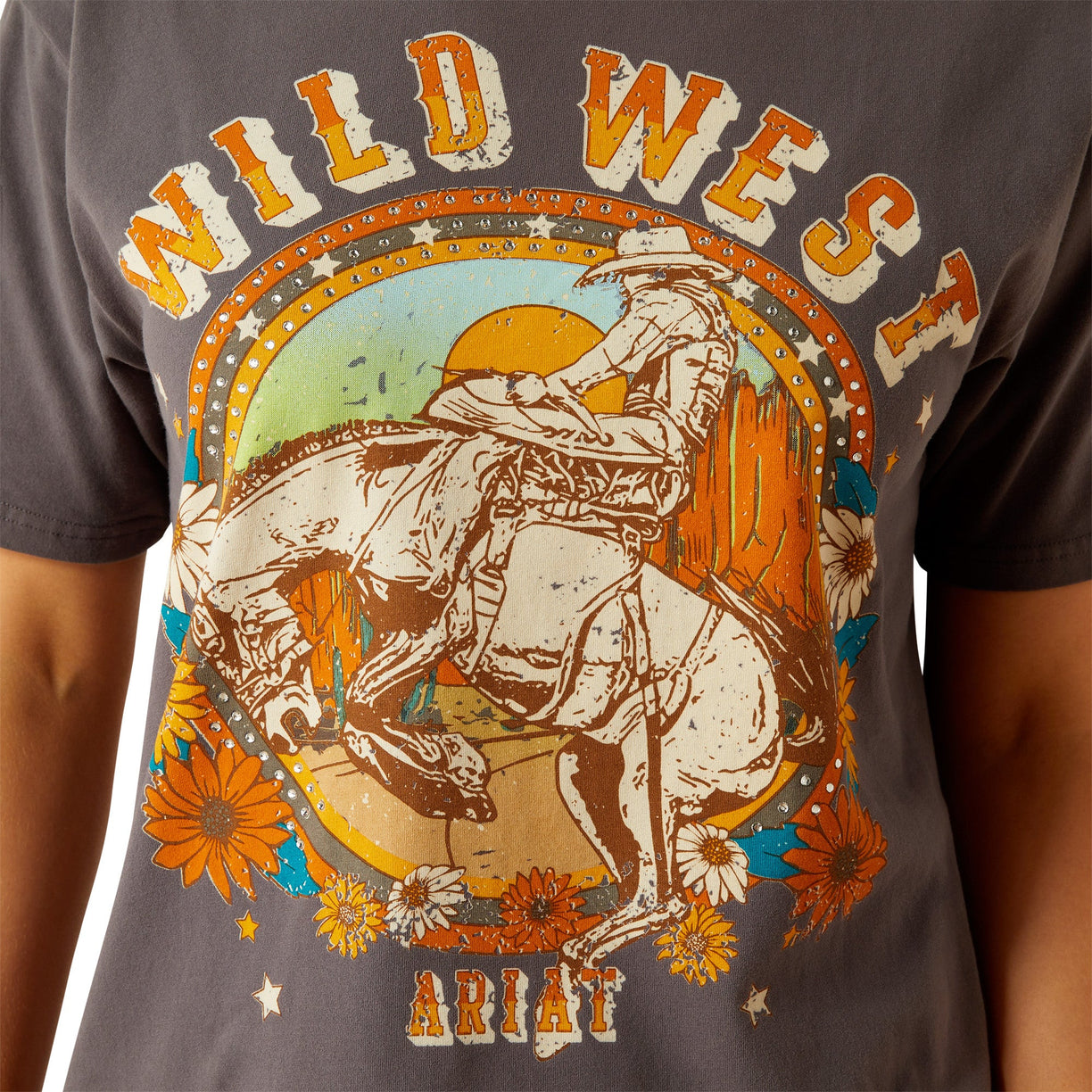 T-shirt with 'Wild West' and Ariat graphic design on a gray background
