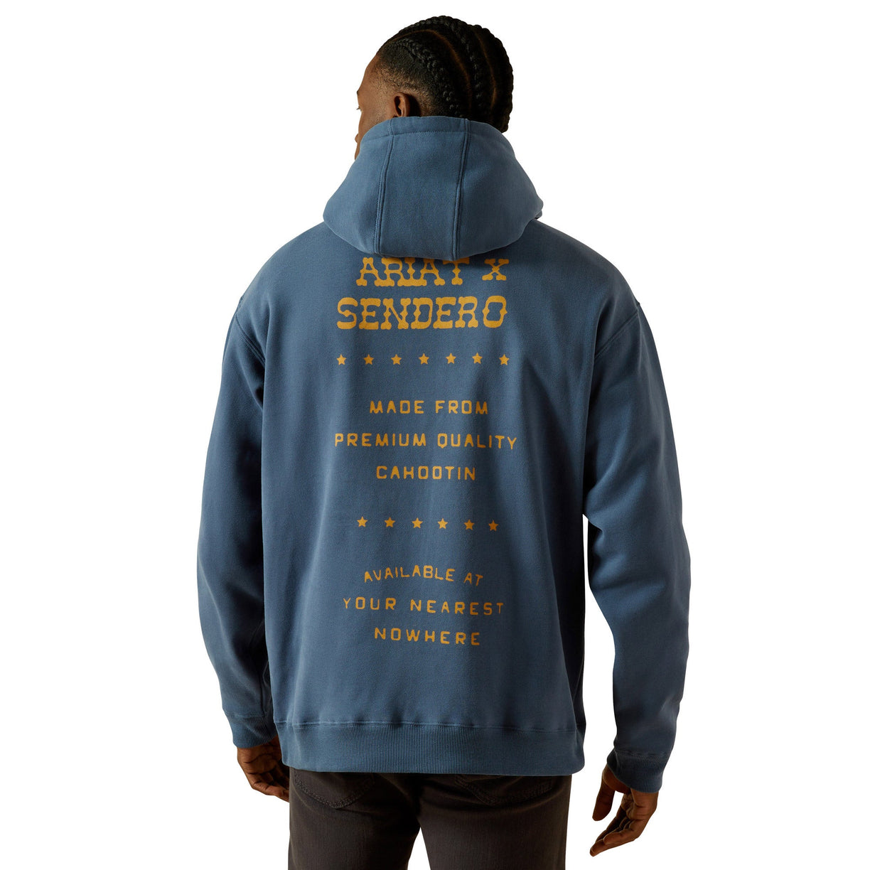 Person wearing a blue hoodie with 'Ariat Sendero' text on the back against a white background