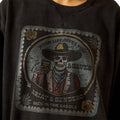Dark gray hoodie with a graphic design featuring a skeleton in a cowboy hat and bandana, holding a bottle of tequila.