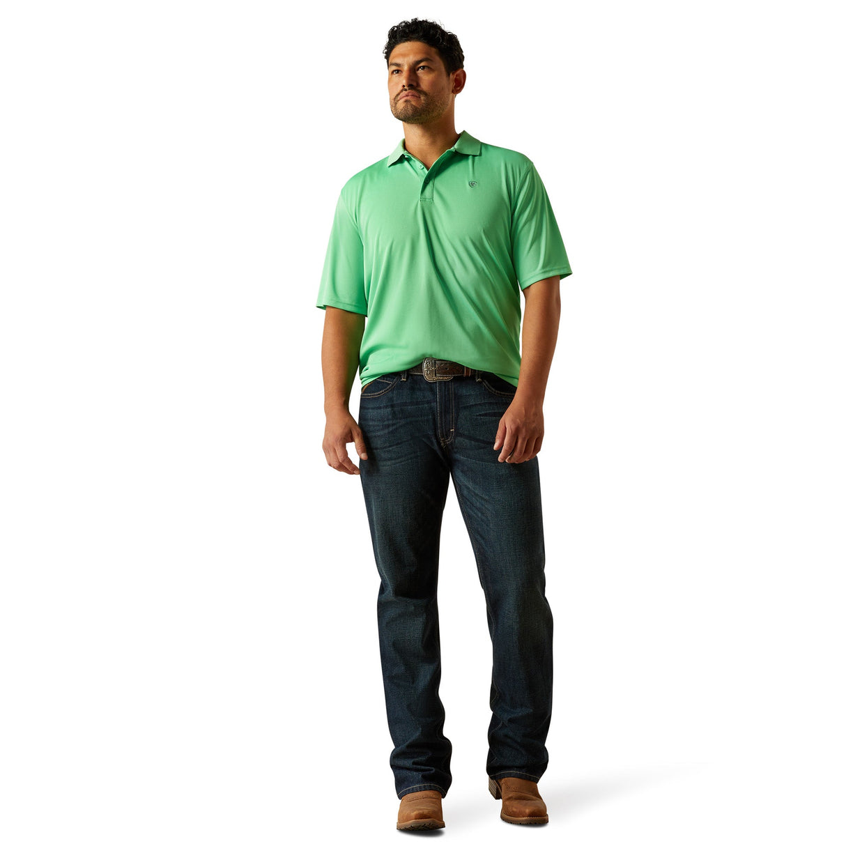 Man wearing a green polo shirt and blue jeans on a white background