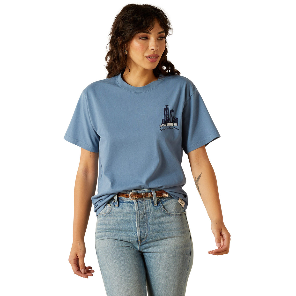 Woman wearing a blue t-shirt with a graphic design on a white background